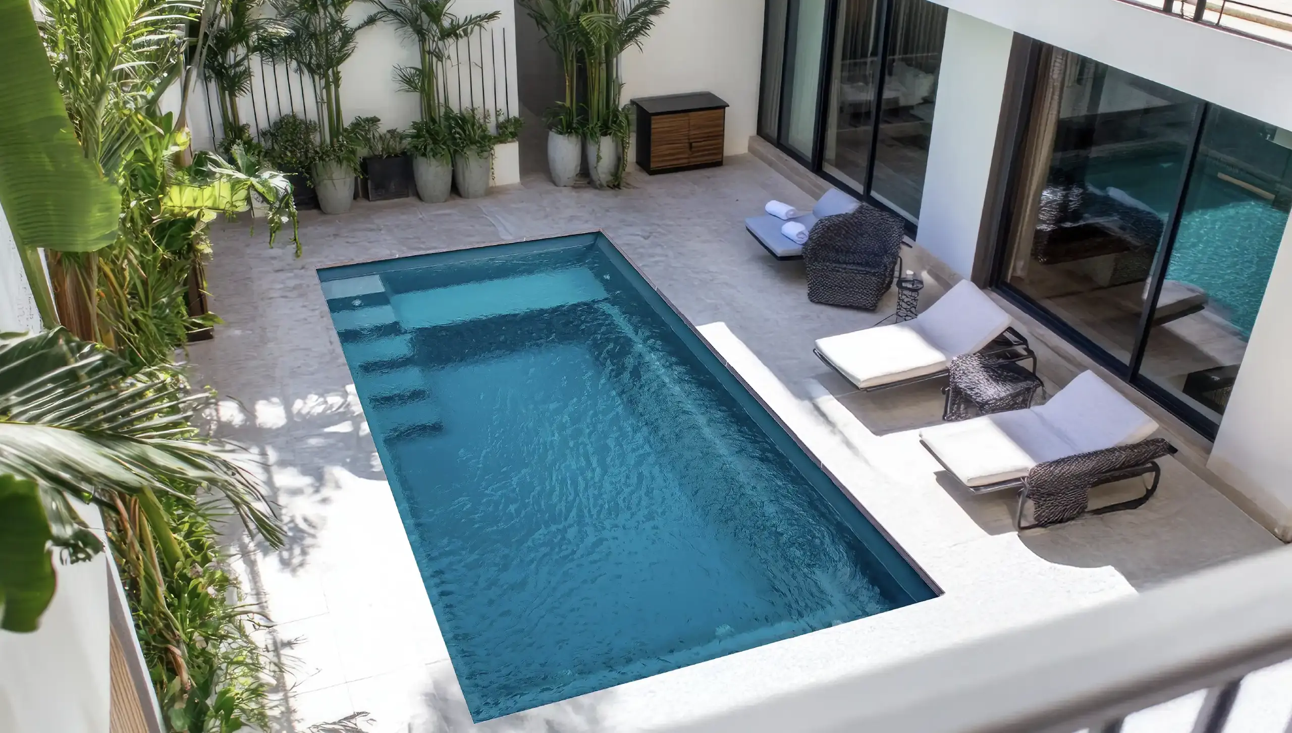 Aurora fiberglass pool — sleek modern design with entry bench