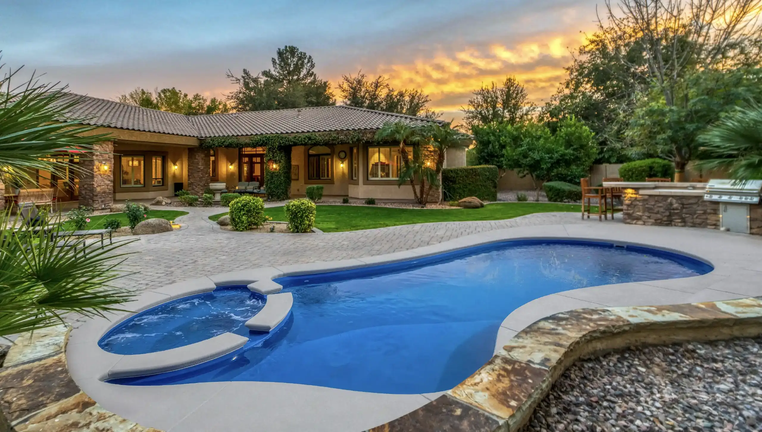 Falls fiberglass pool — oval shape with splash pad cascade
