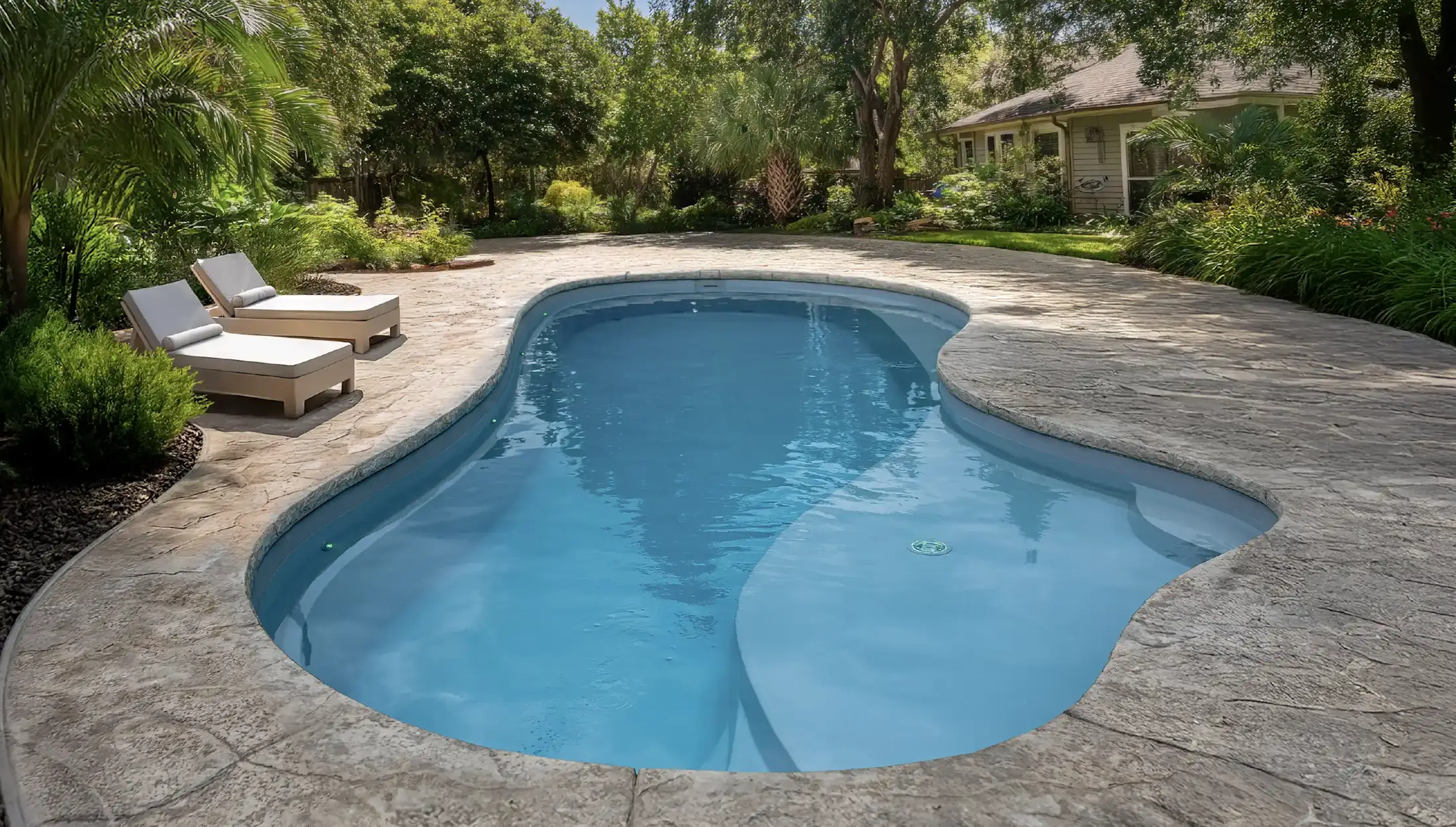 Maldives fiberglass pool — soft curves with spacious tanning ledge