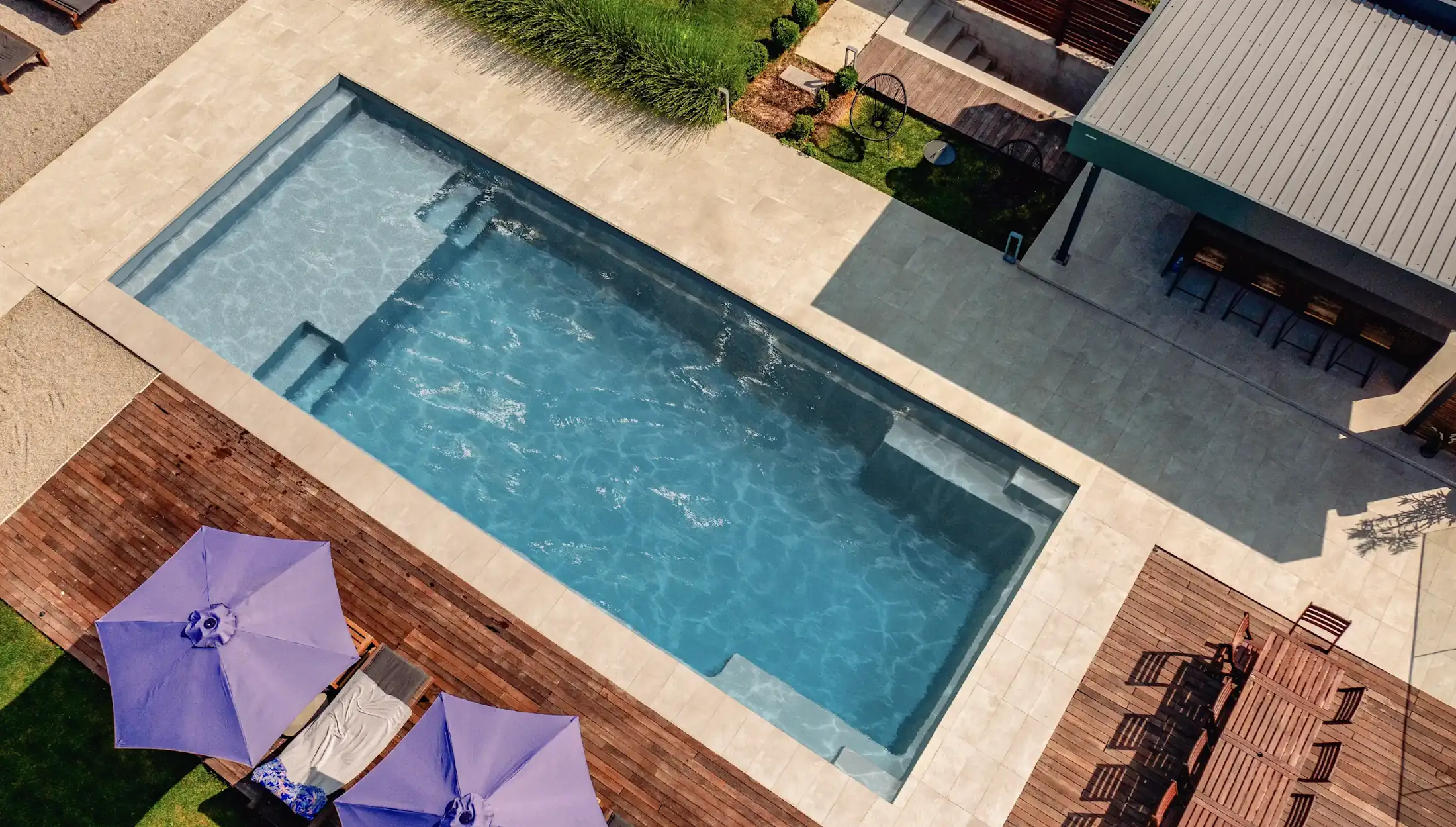 Aerial view of modern rectangular pool with integrated spa